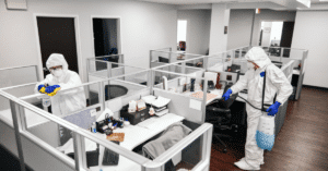 cleaners sanitizing an office